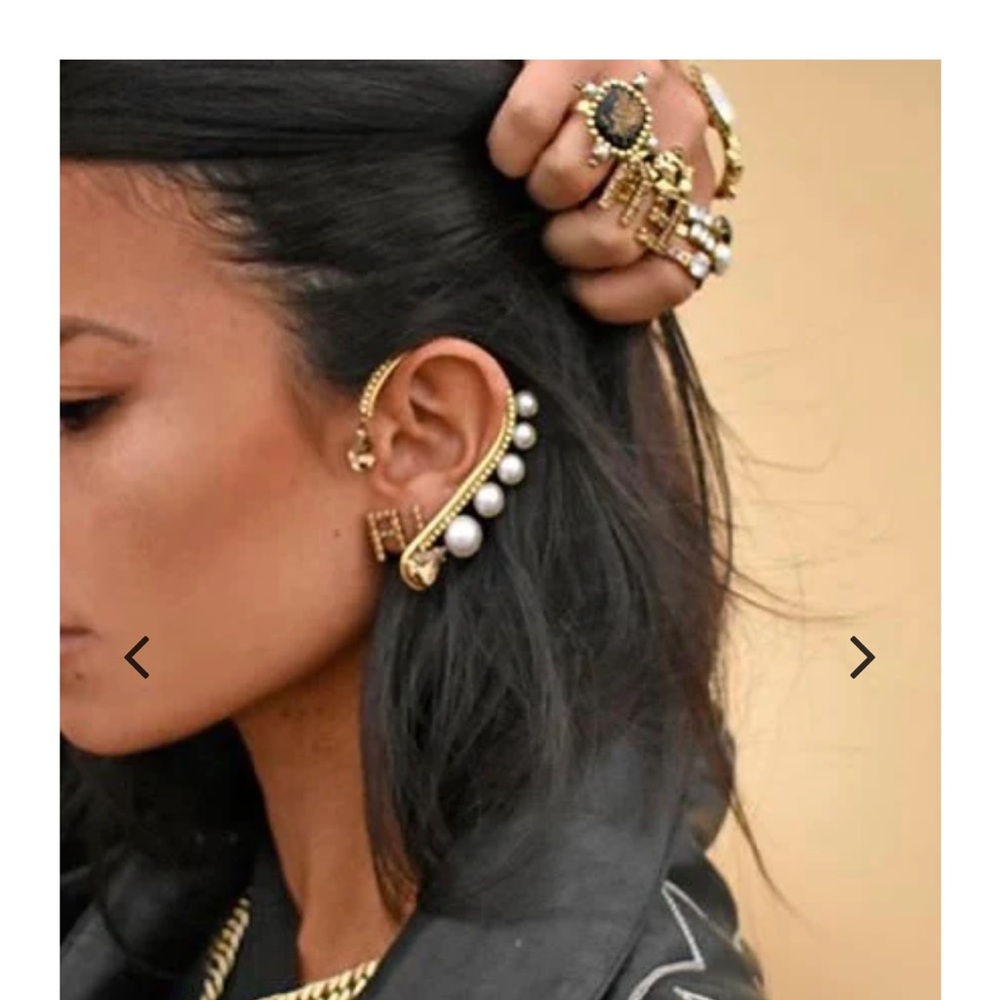 Pair of gold rhinestone ear wrap cuffs.